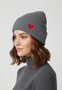 Gemusterte Strickm�tze mit Rippb�ndchen dezenter Stickerei
