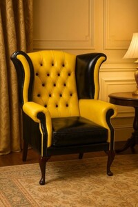 Casa Padrino Luxus Chesterfield Leder Ohrensessel Gelb / Schwarz / Braun H. 110 cm